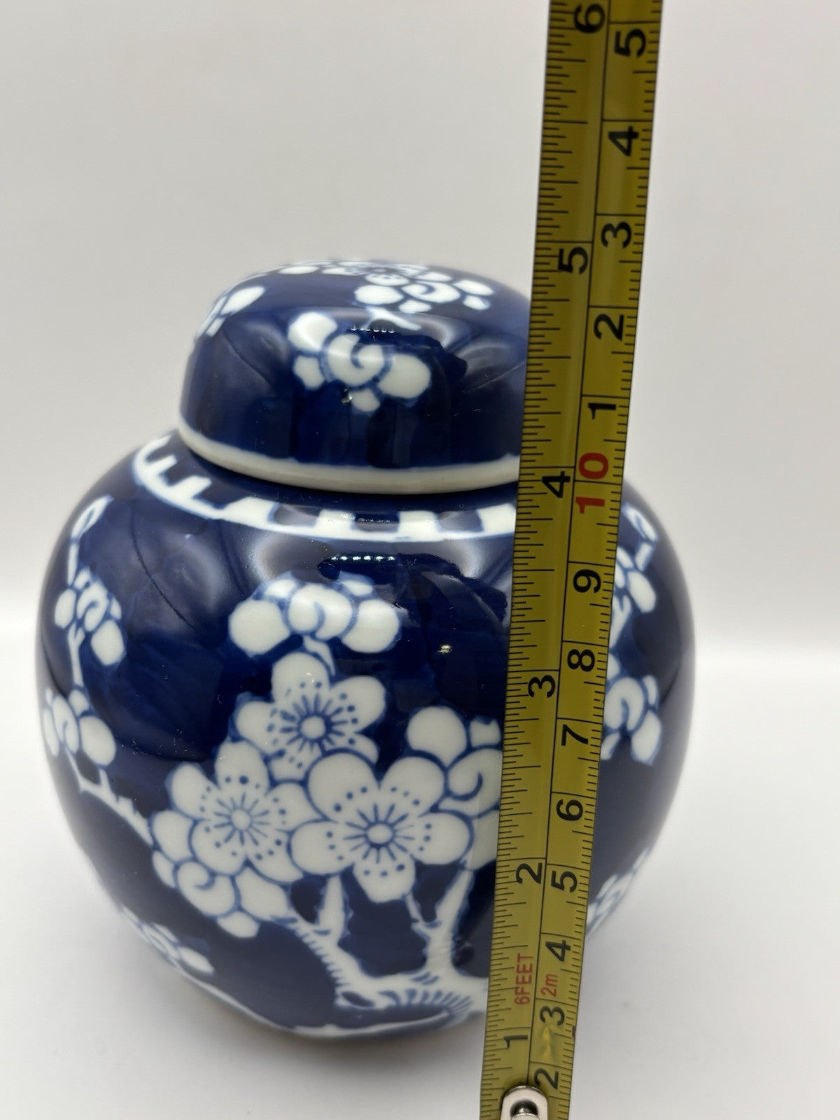 Chinese ginger jar is a blue and white porcelain piece hand-painted design.