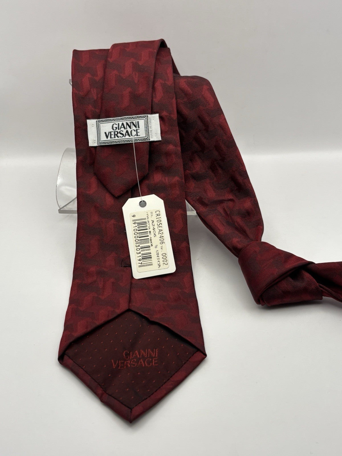 Versace 100% dark red silk and features a subtle zebra pattern.