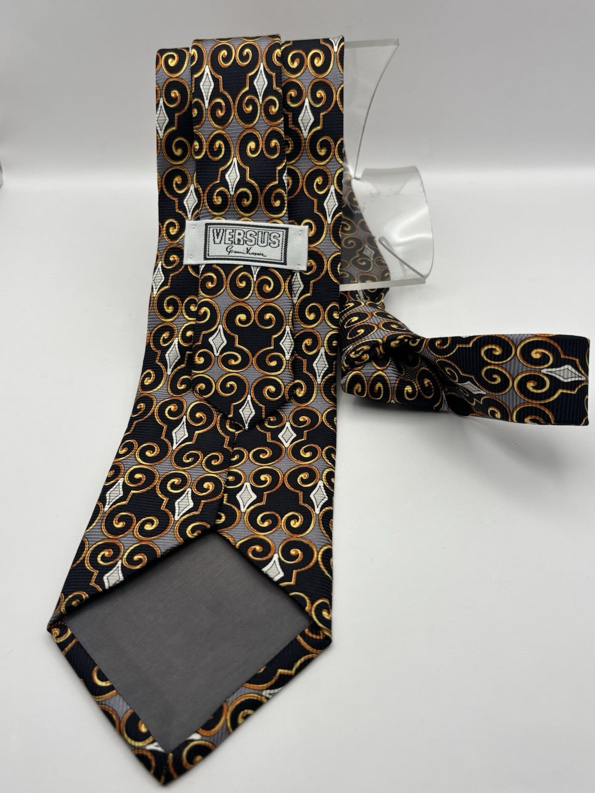 Versace Tie With A geometric scroll pattern in gold and black with white accents
