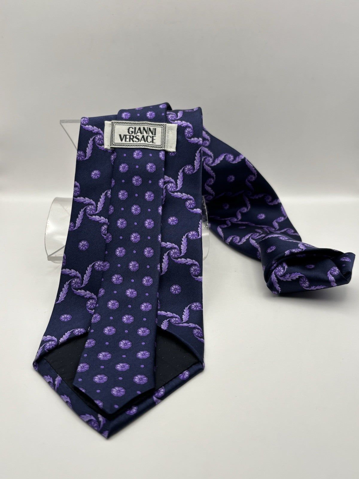 Versace Silk Tie pattern in shades of purple on a navy background