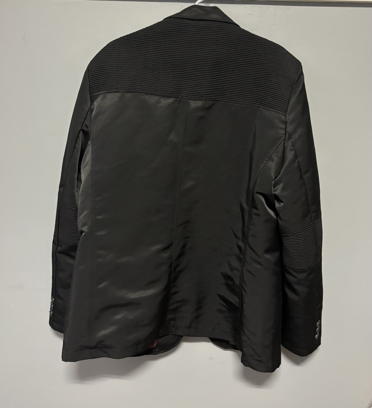 Black Platini blazer with quilted shoulder and elbow details.