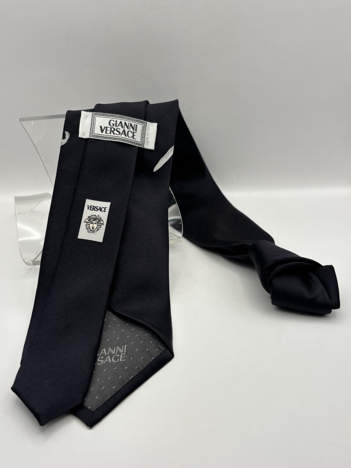 Versace Black Silk Tie with A Prominent White Floral Botanical Design