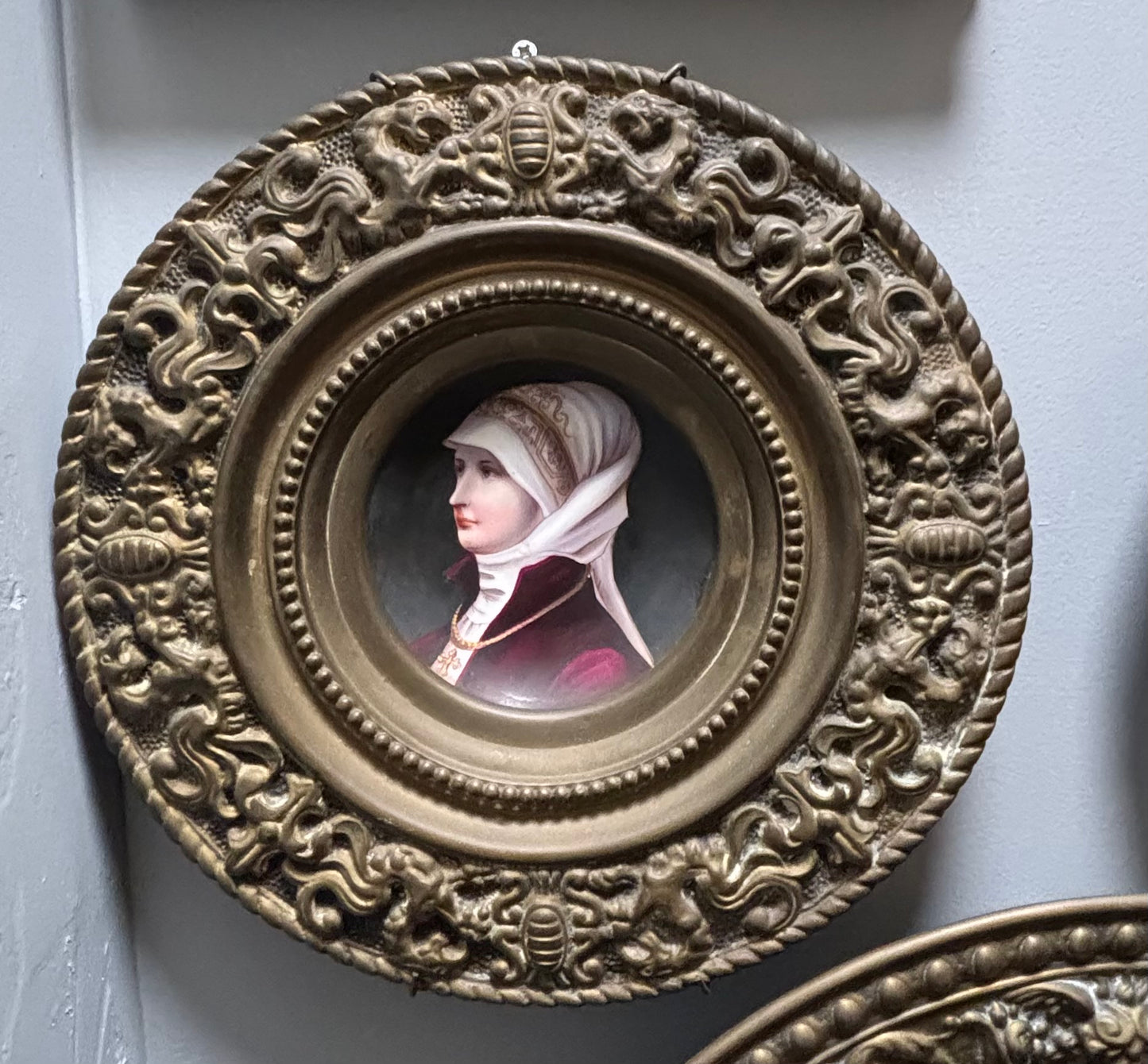 Antique, ceramic plate, 19th century, hand-painted decoration, woman with a scarf, brass entourage, coat of arms, dragon, French work