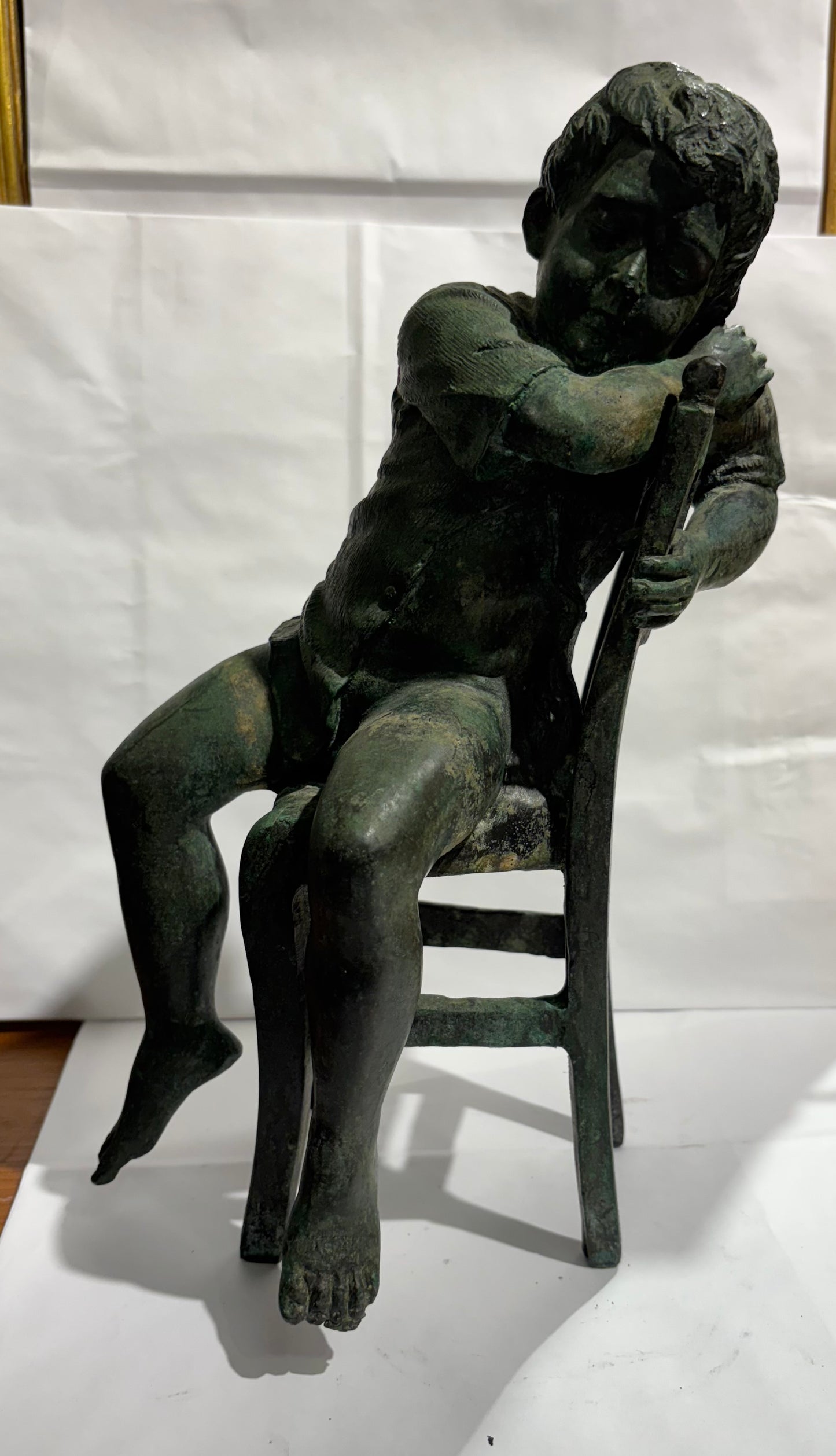 A Vintage Maitland Smith Bronze Sculpture of a Boy sitting on a Chair
