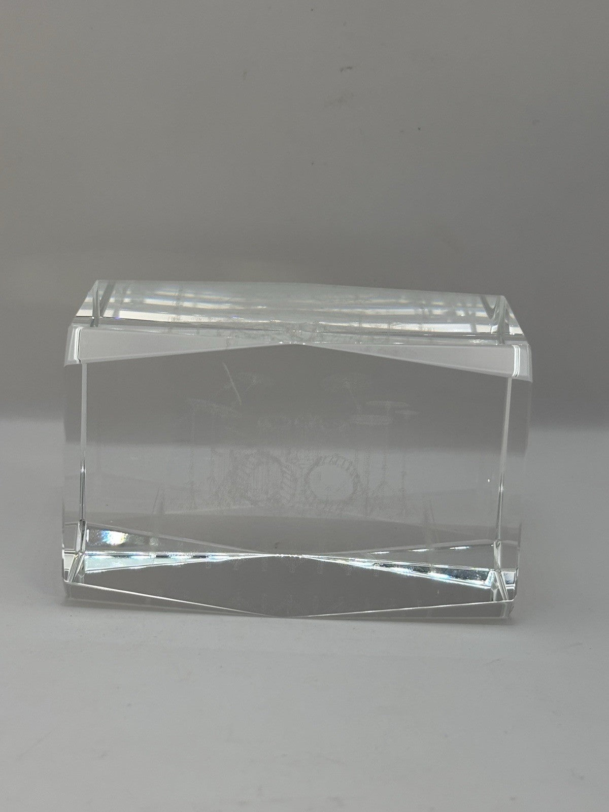 3D laser-etched crystal block paperweight featuring a drum set design
