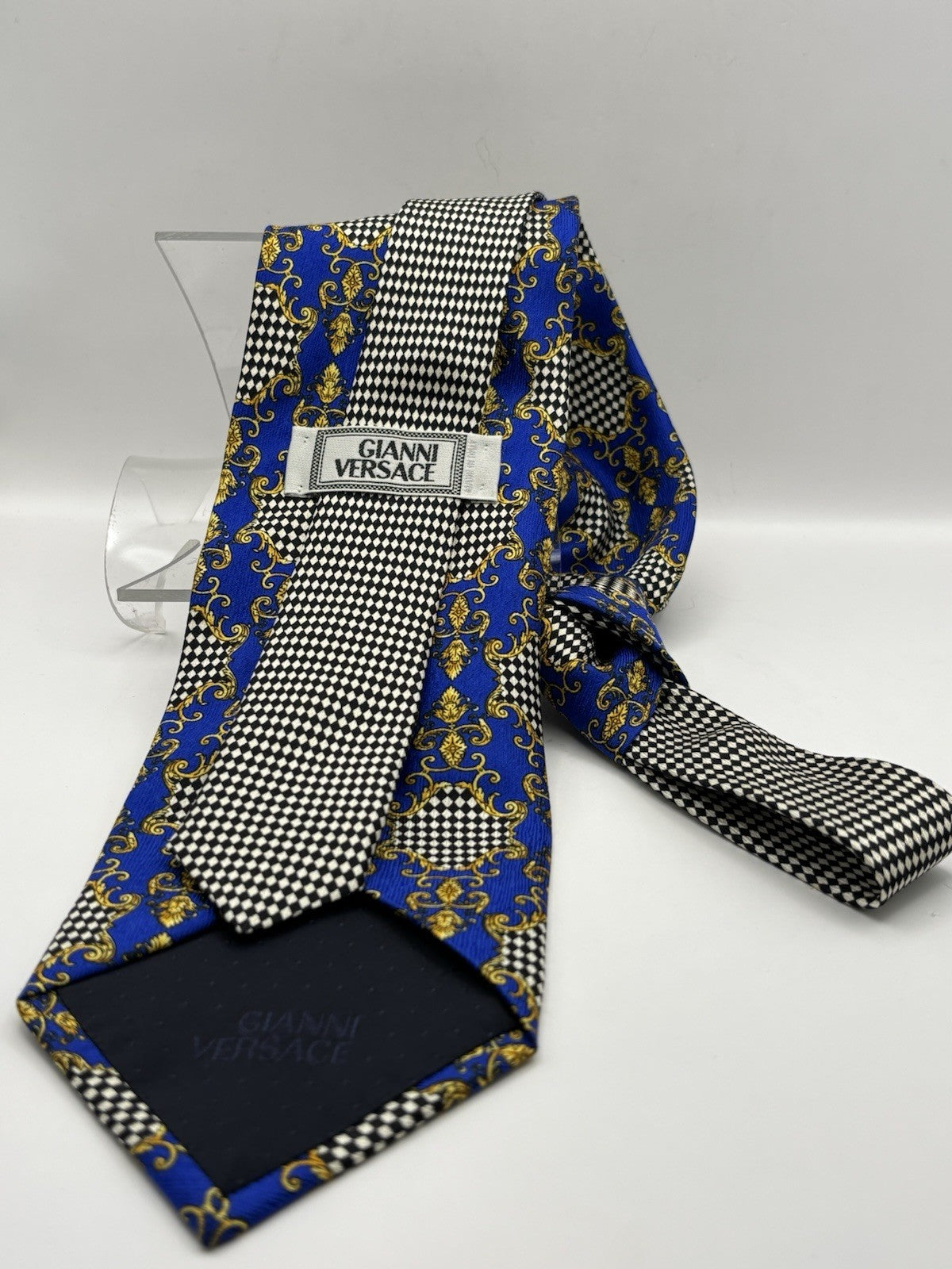 Gianni Versace necktie blue and gold Baroque print with checkered patterns.