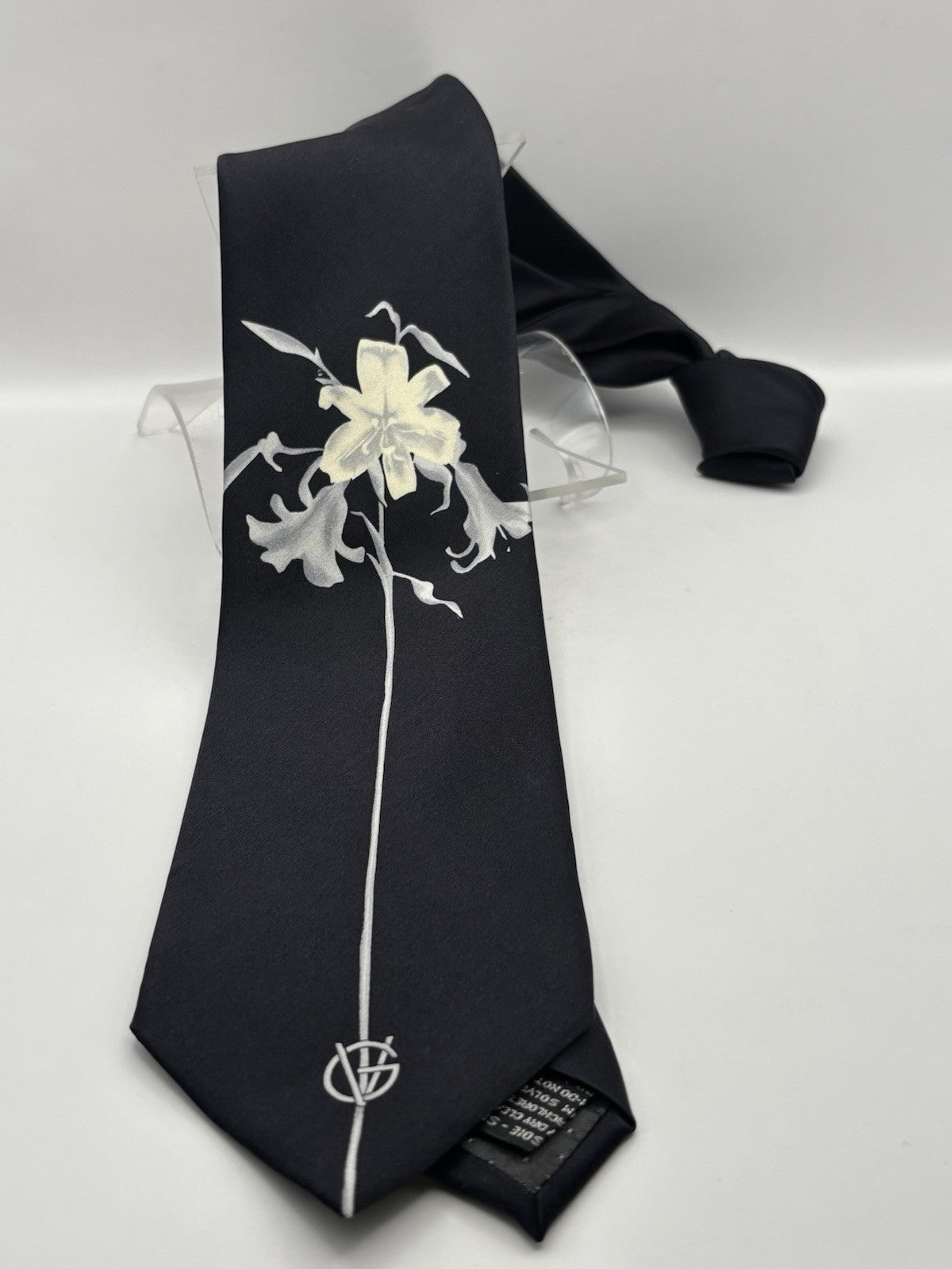 Versace Black Silk Tie with A Prominent White Floral Botanical Design