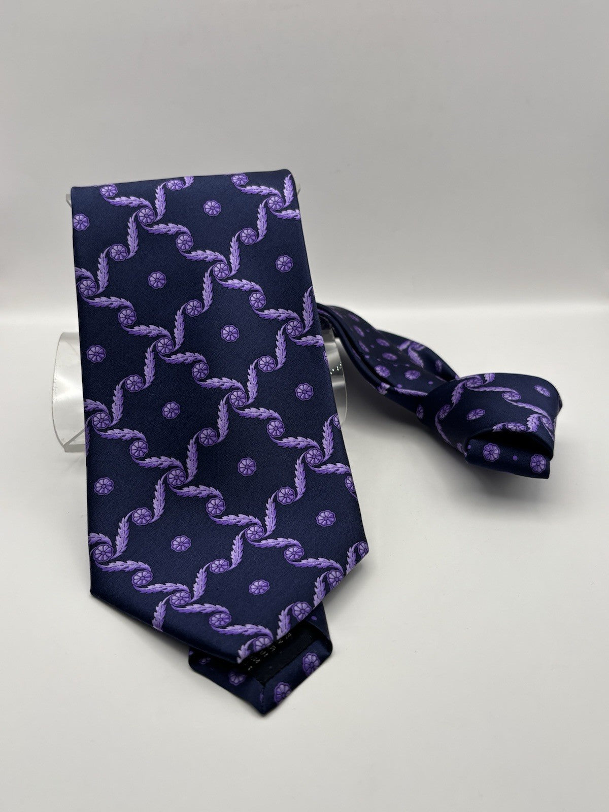 Versace Silk Tie pattern in shades of purple on a navy background