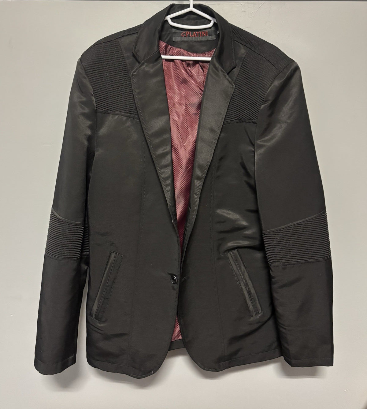Black Platini blazer with quilted shoulder and elbow details.