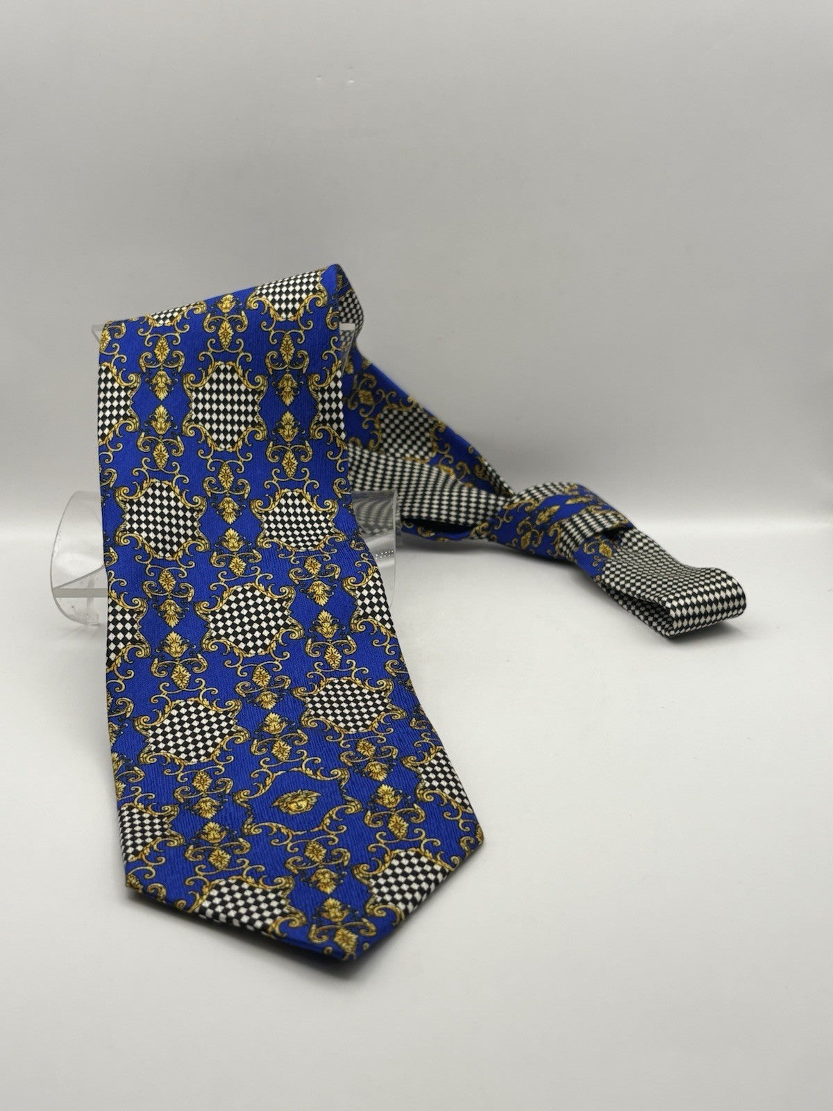 Gianni Versace necktie blue and gold Baroque print with checkered patterns.
