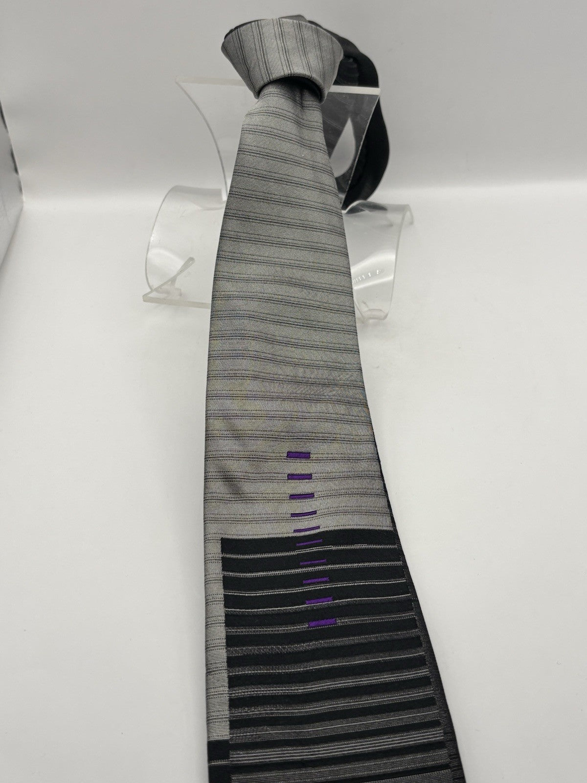 Gianni Versace necktie black and silver striped design Medusa head logo.