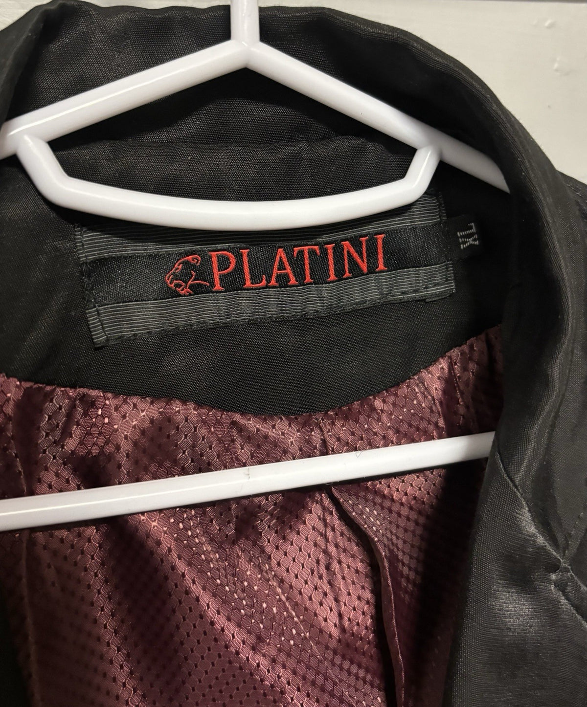 Black Platini blazer with quilted shoulder and elbow details.