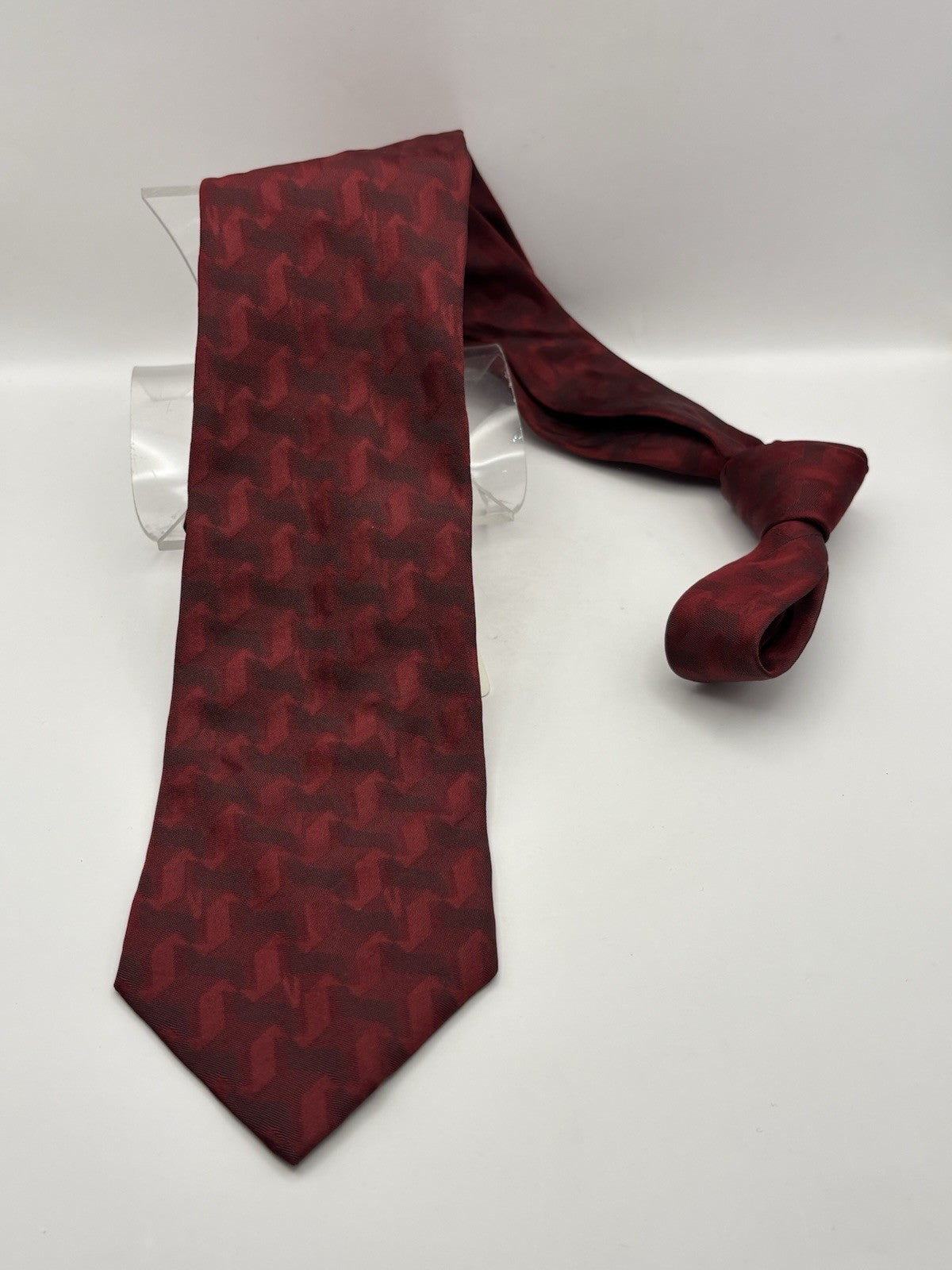 Versace 100% dark red silk and features a subtle zebra pattern.