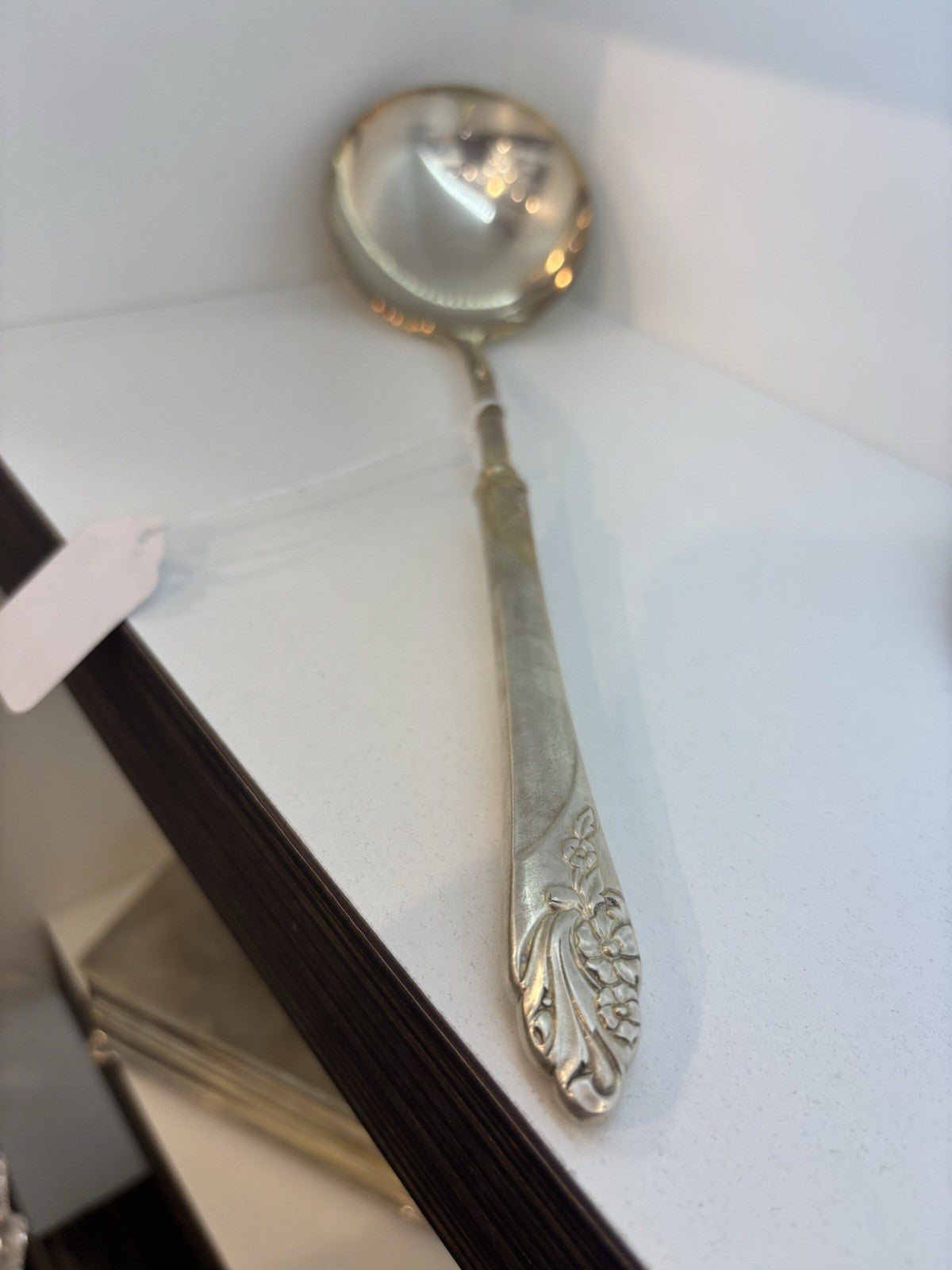 Vintage spoon with a traced design of beautiful flowers on the handle