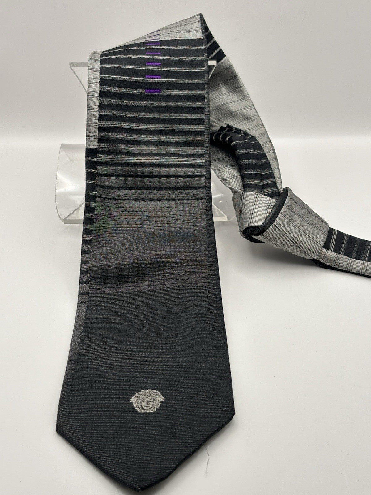 Gianni Versace necktie black and silver striped design Medusa head logo.
