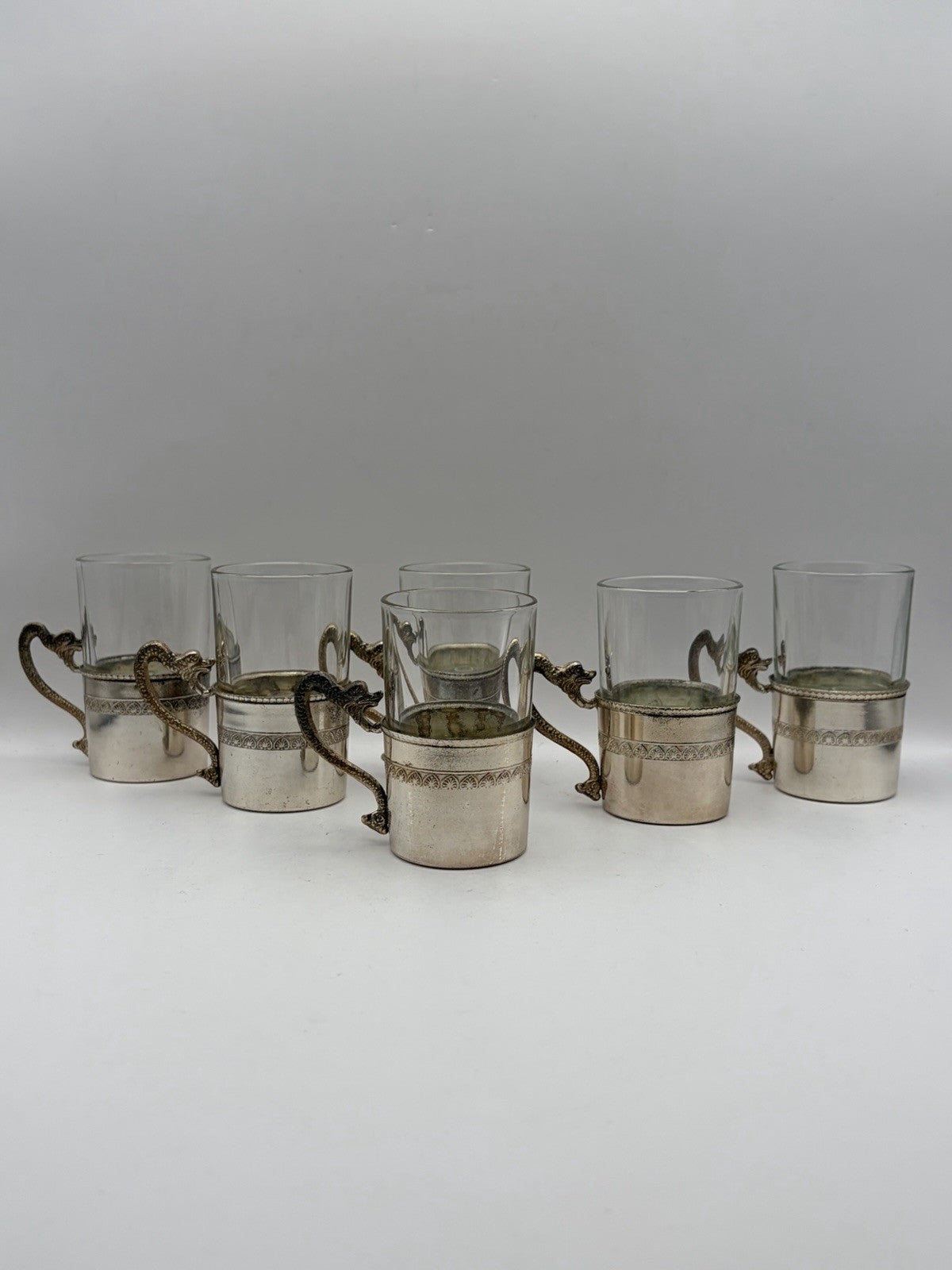 Vintage Italian shot glasses silver-plated holders with intricate dragon handles
