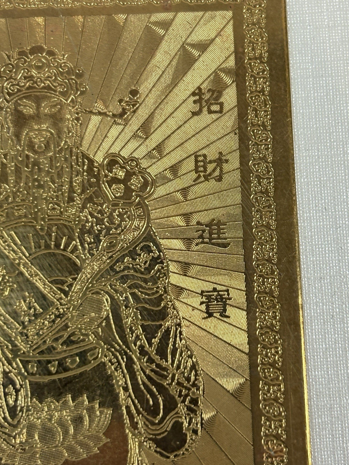 pure gold-plated Chinese amulet card featuring the God of Wealth (Cai Shen).