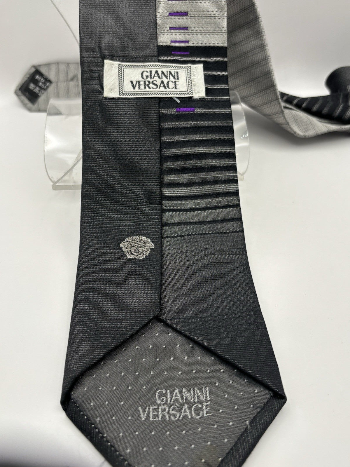 Gianni Versace necktie black and silver striped design Medusa head logo.