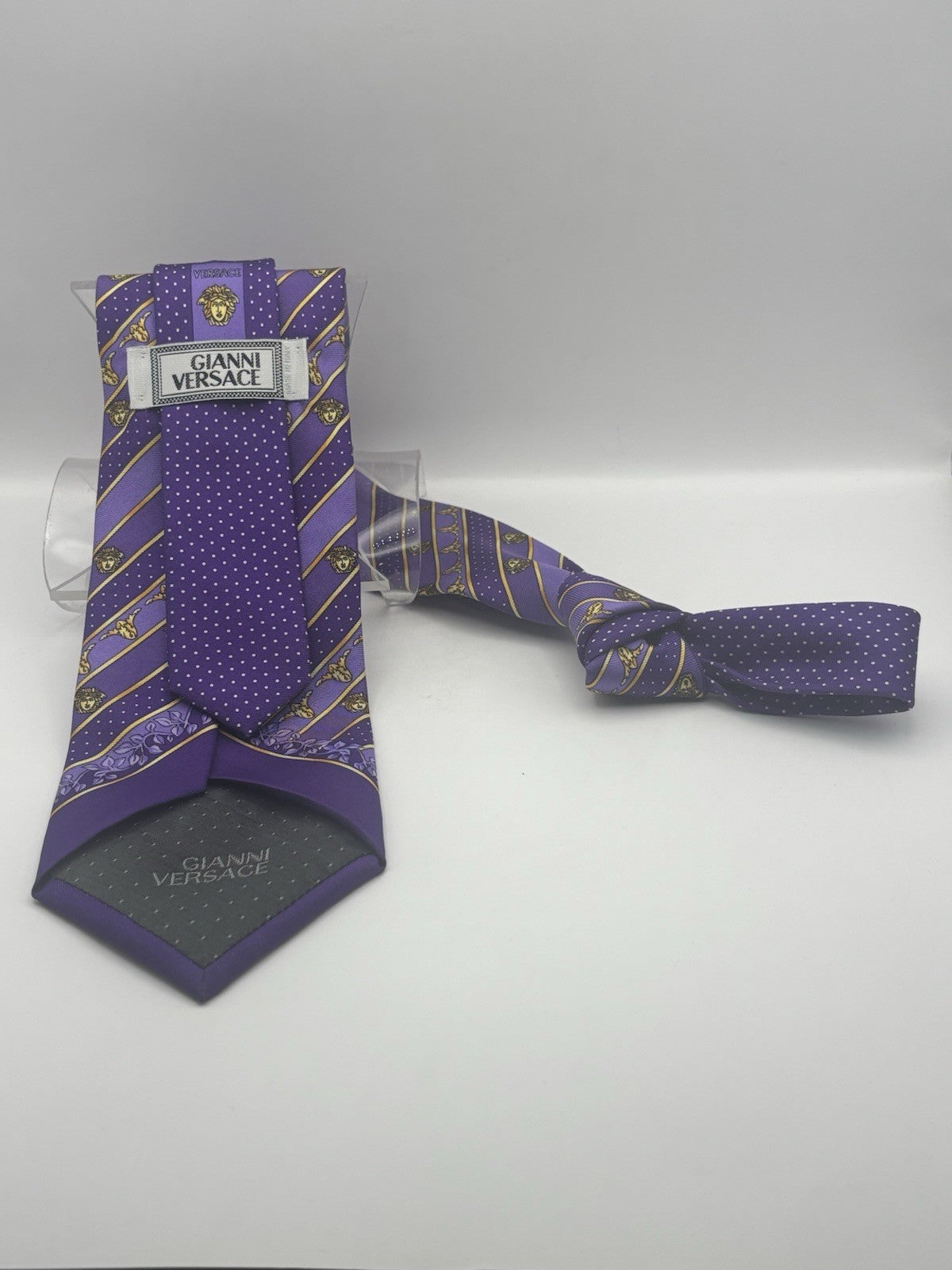 Gianni Versace silk tie purple and gold stripes with a Medusa head motif.