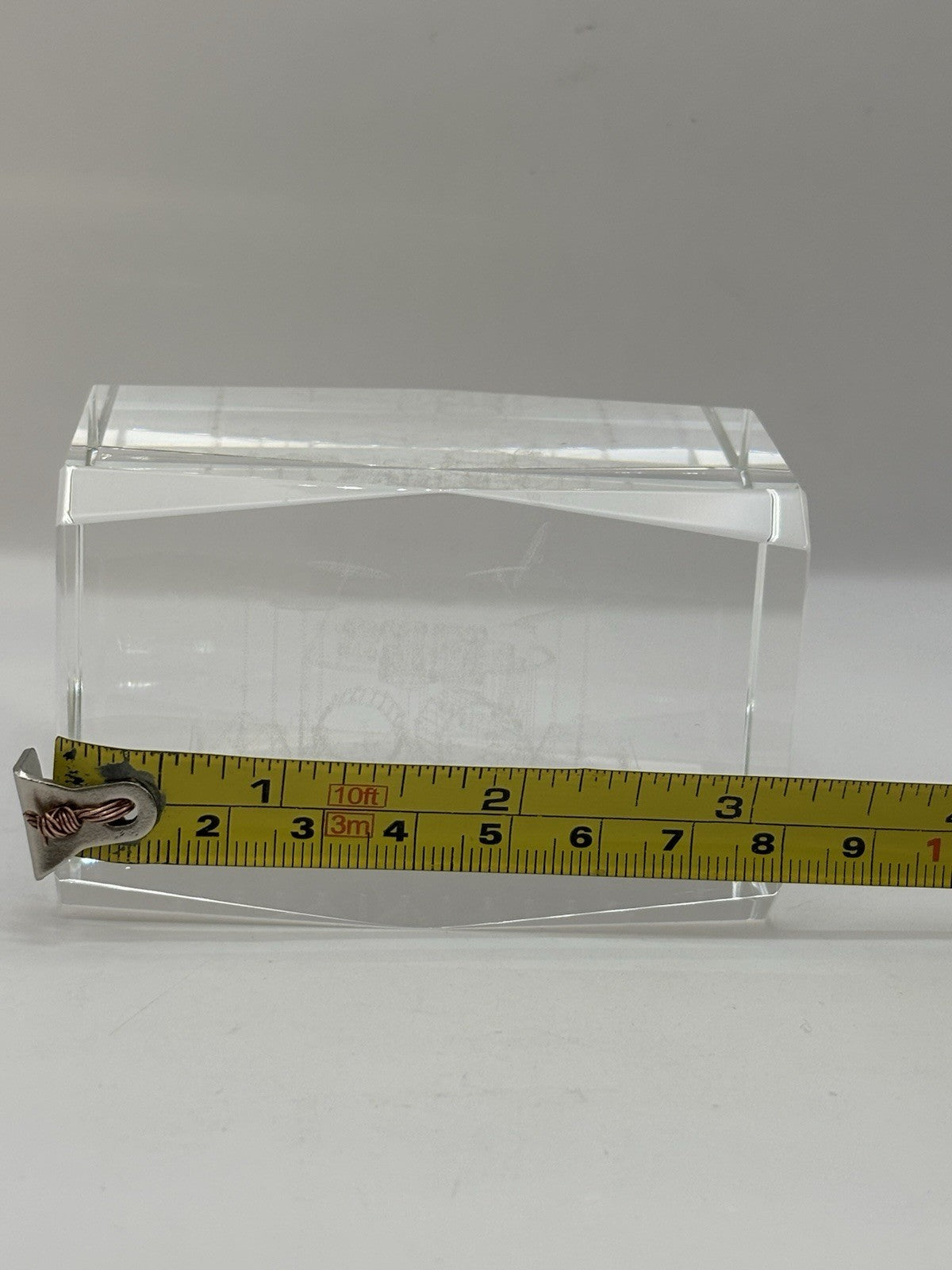 3D laser-etched crystal block paperweight featuring a drum set design