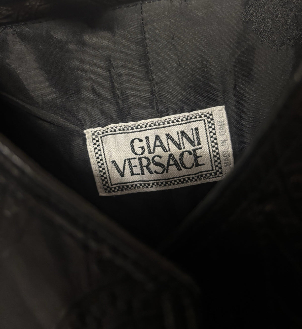 Versace black leather vest with an embossed pattern. Size not know