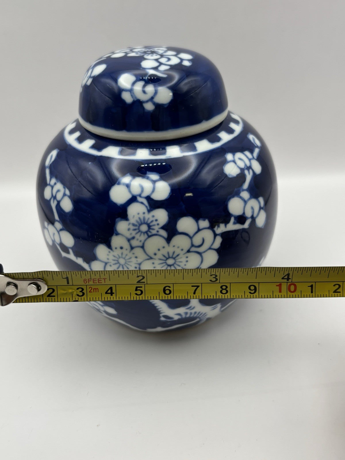 Chinese ginger jar is a blue and white porcelain piece hand-painted design.
