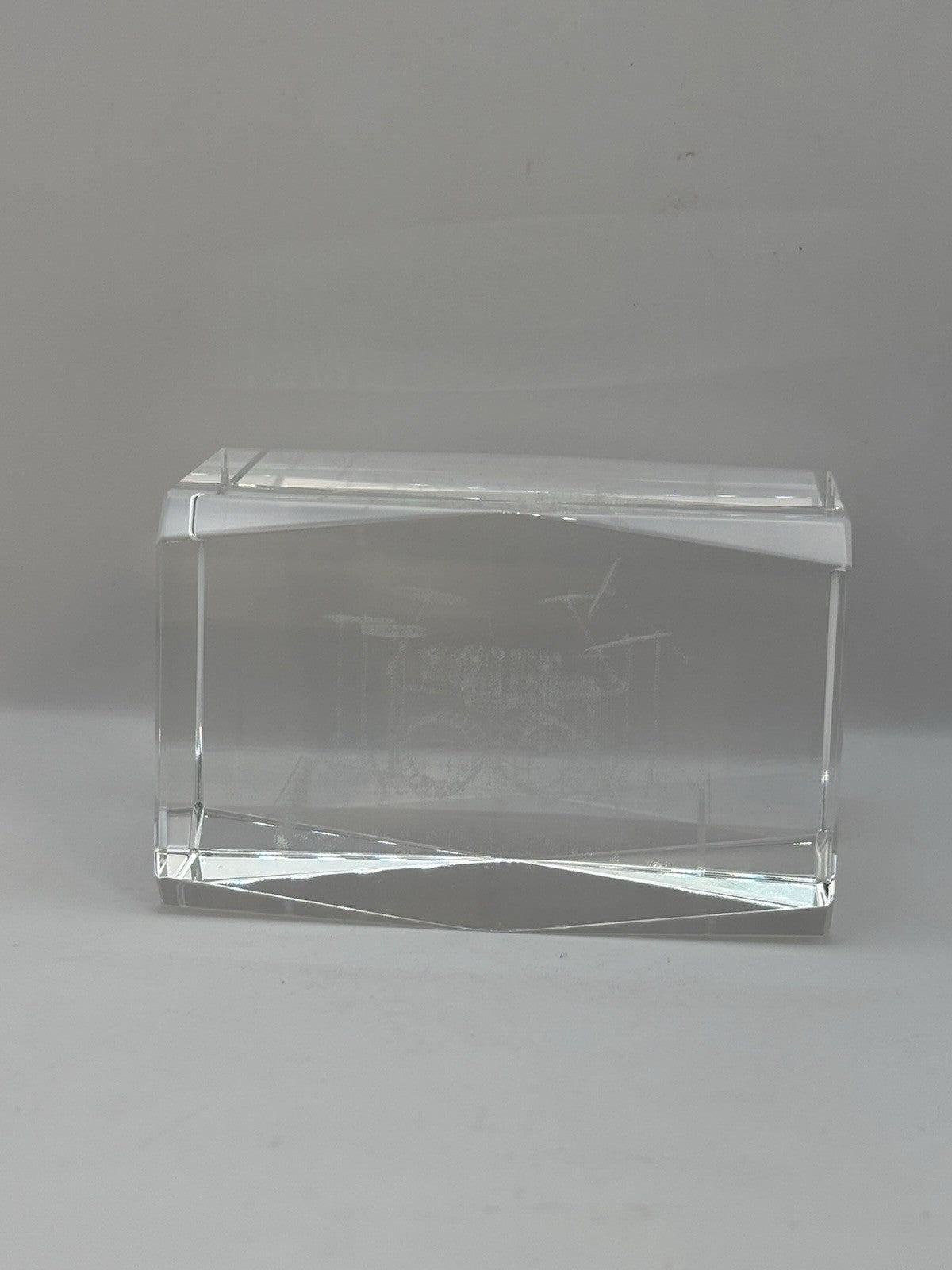 3D laser-etched crystal block paperweight featuring a drum set design
