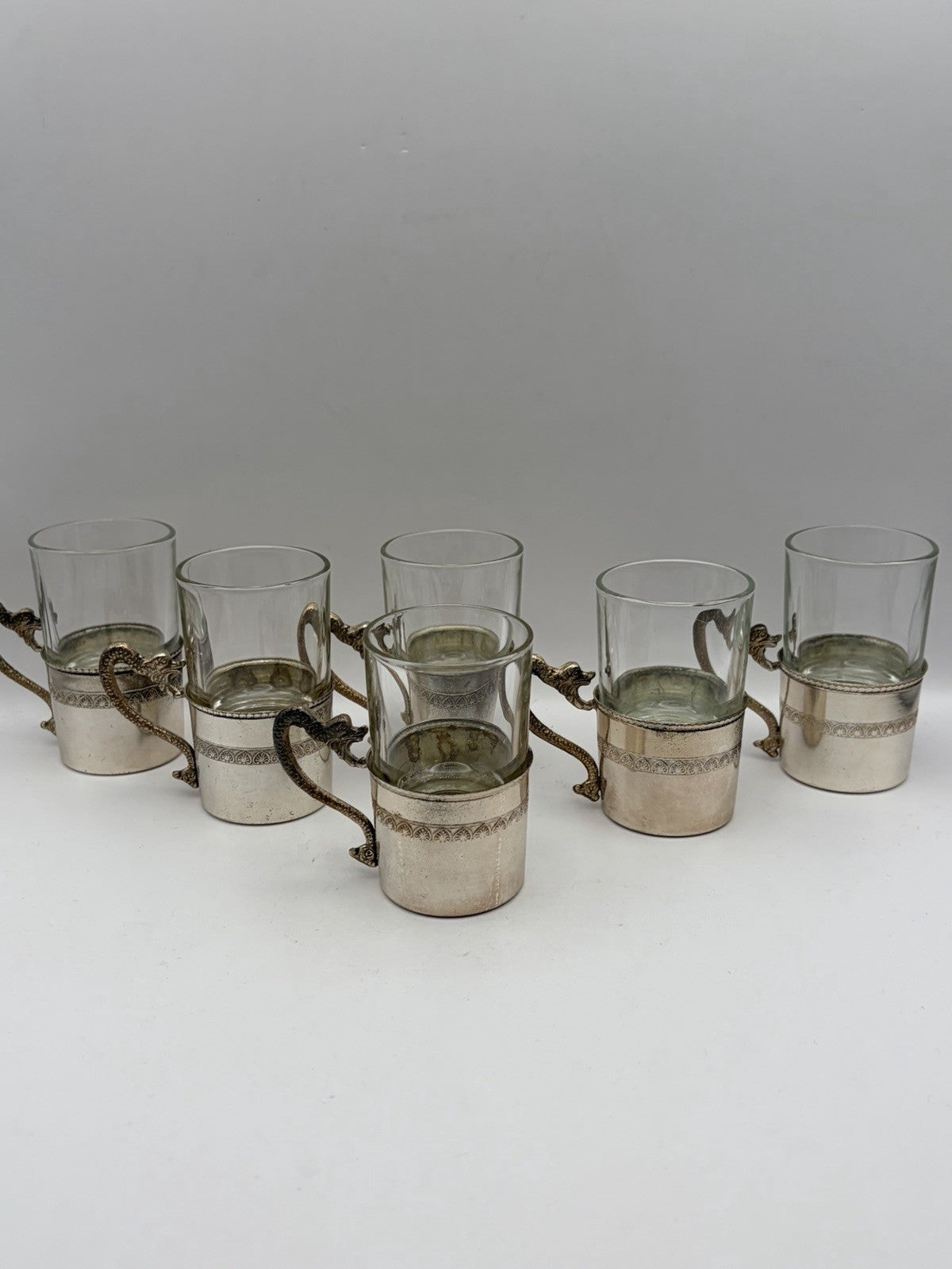 Vintage Italian shot glasses silver-plated holders with intricate dragon handles