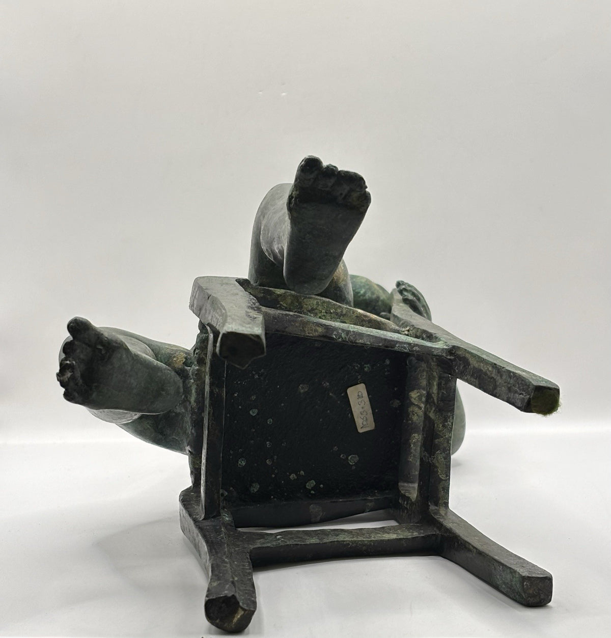 Maitland-Smith bronze boy in a chair, distinctive verde finish and brown patina.