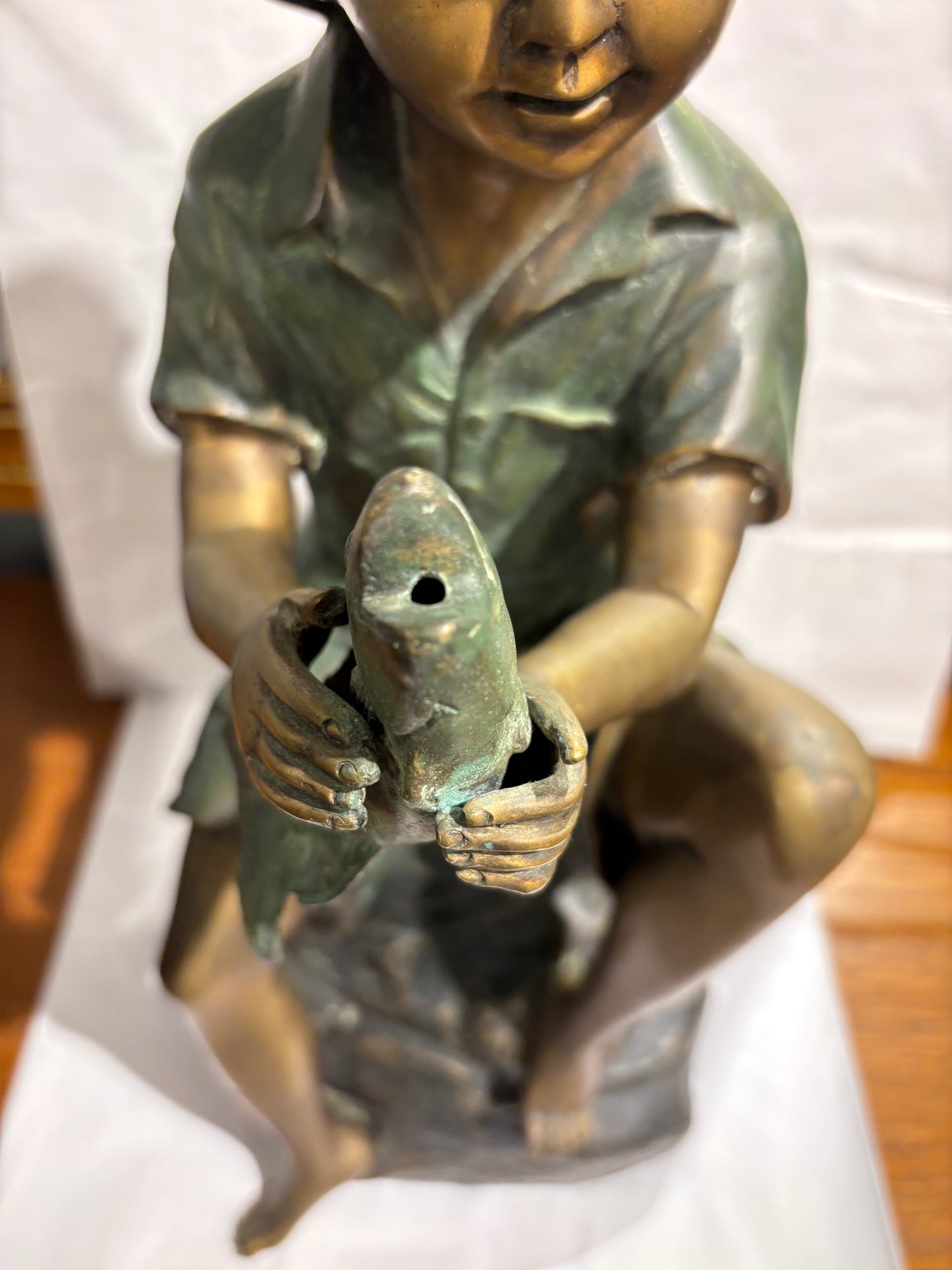 Boy Holding a Fish Bronze statue