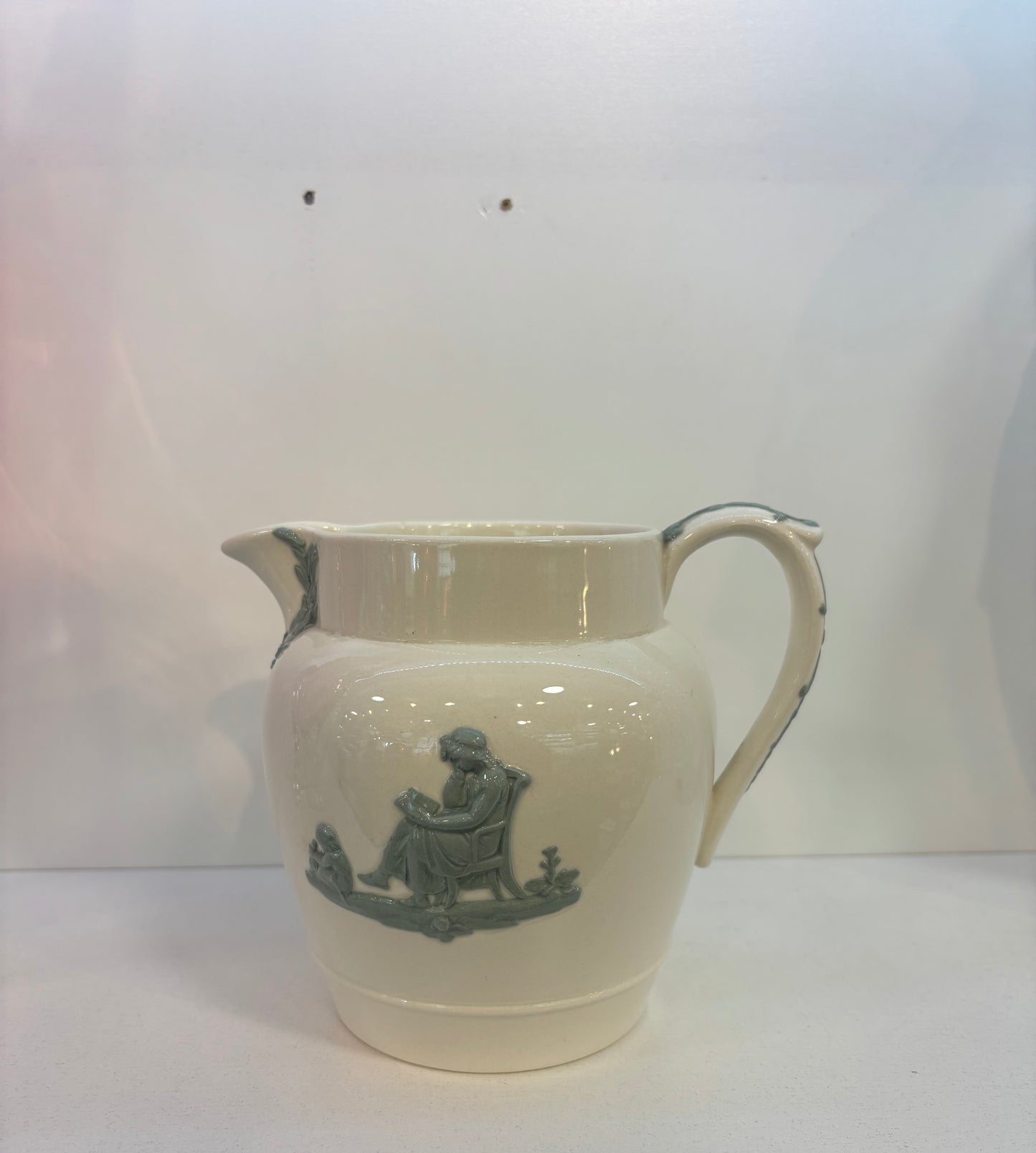 WEDGWOOD OF ETRURIA & BARLASTON EMBOSSED QUEENSWARE BLUE ON CREAM PITCHER