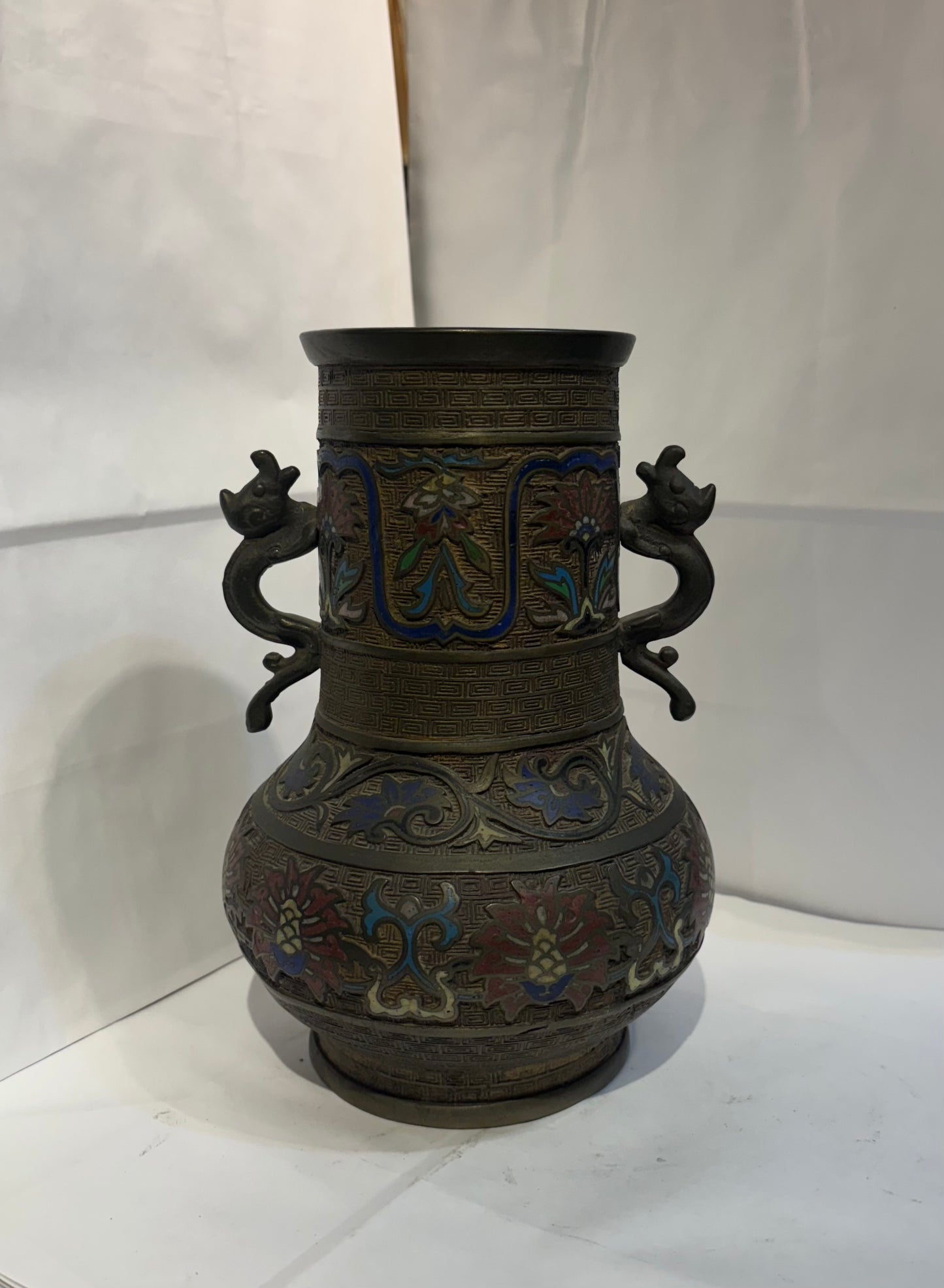 Antique Etched Brass Bronze Champleve Enamel Flowers Vase, Cloisonne Urn with Dragon Side Handles, Greek Key Pattern, Japan 1800s - 1920s
9 1/2