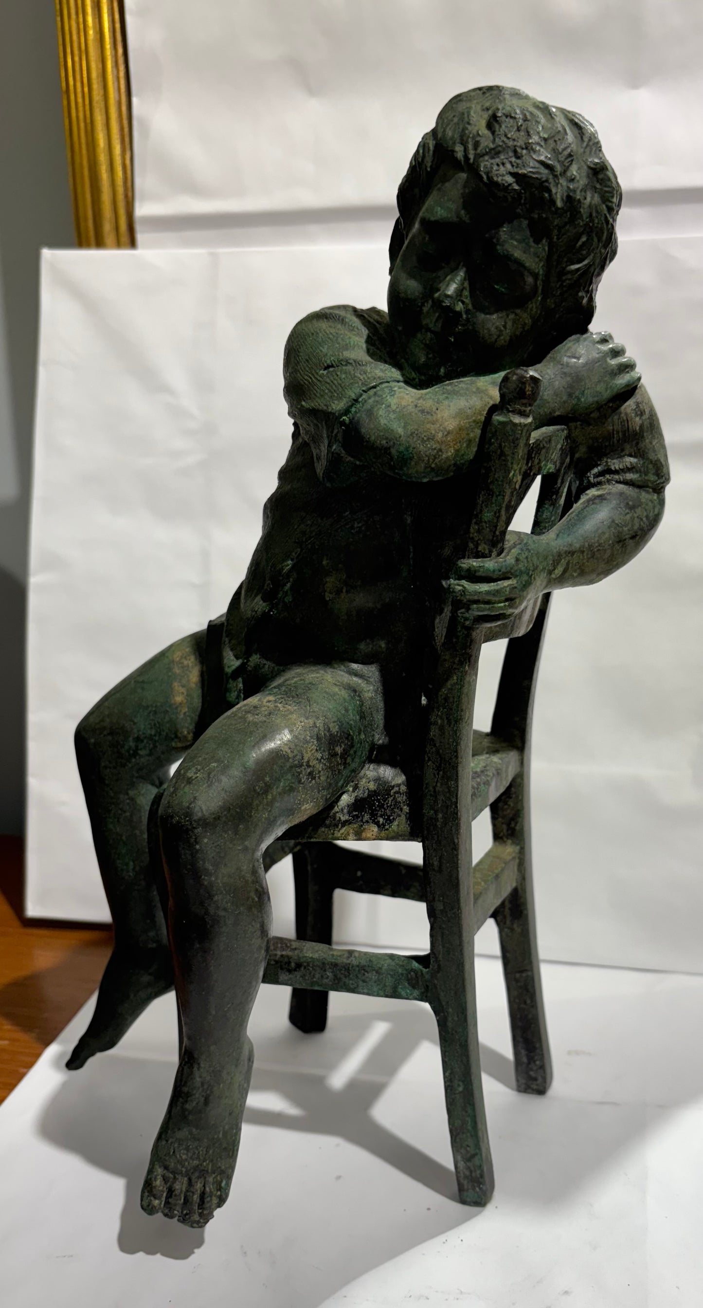 A Vintage Maitland Smith Bronze Sculpture of a Boy sitting on a Chair