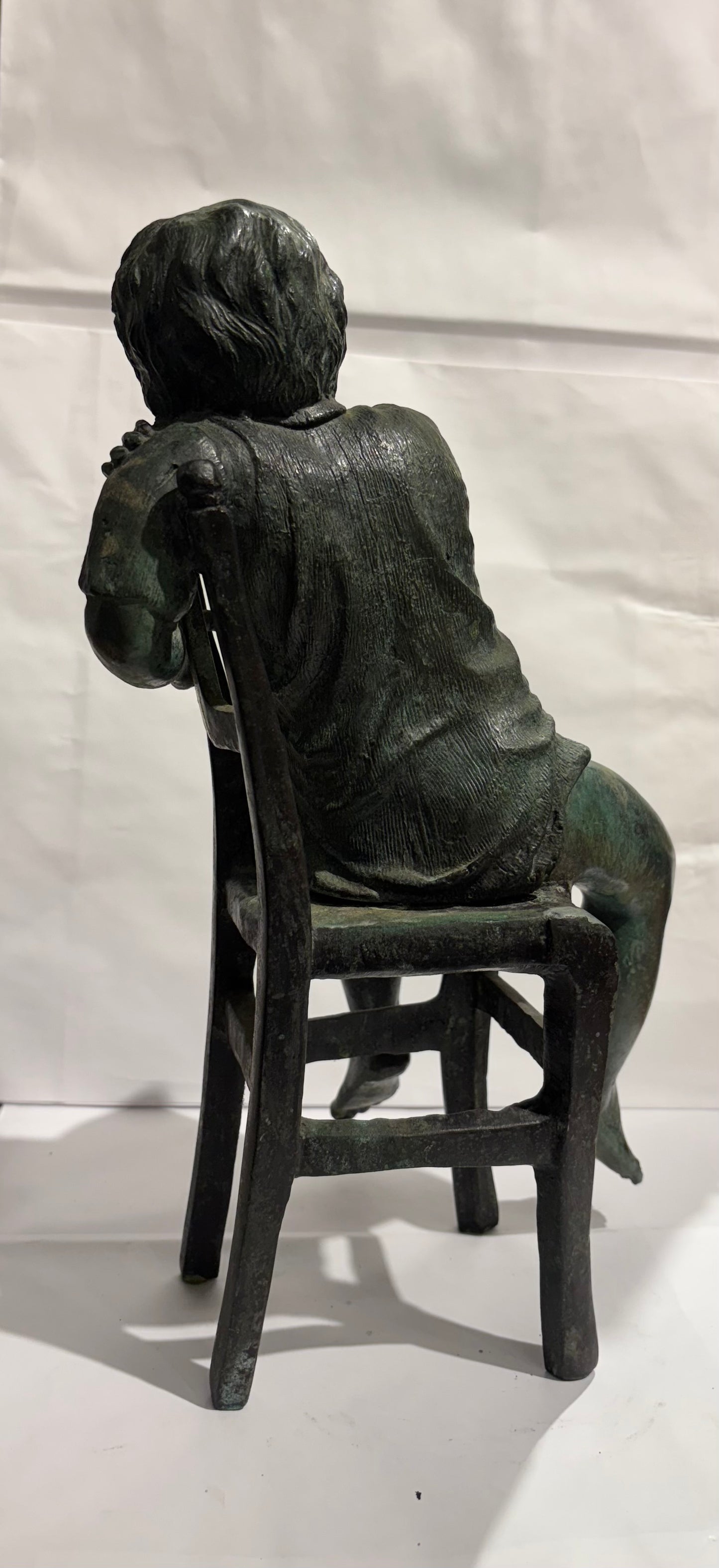 A Vintage Maitland Smith Bronze Sculpture of a Boy sitting on a Chair