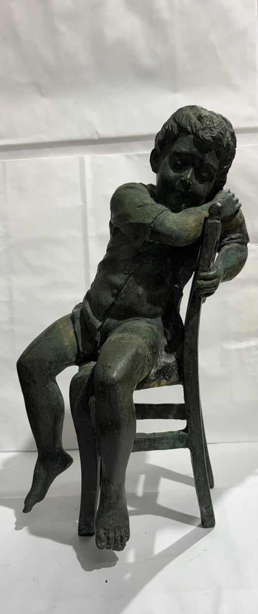 A Vintage Maitland Smith Bronze Sculpture of a Boy sitting on a Chair