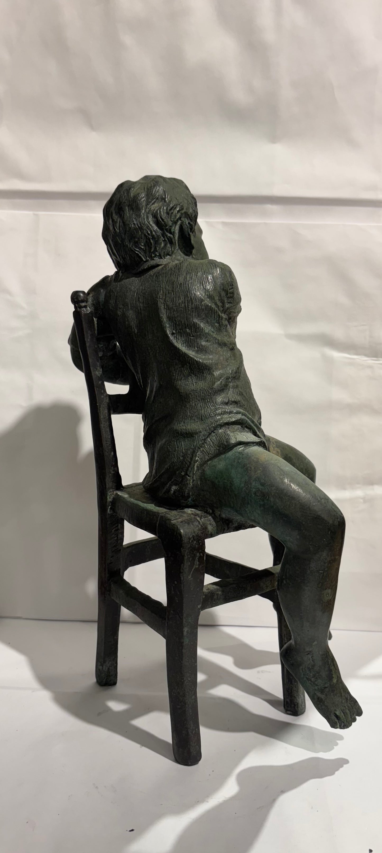 A Vintage Maitland Smith Bronze Sculpture of a Boy sitting on a Chair