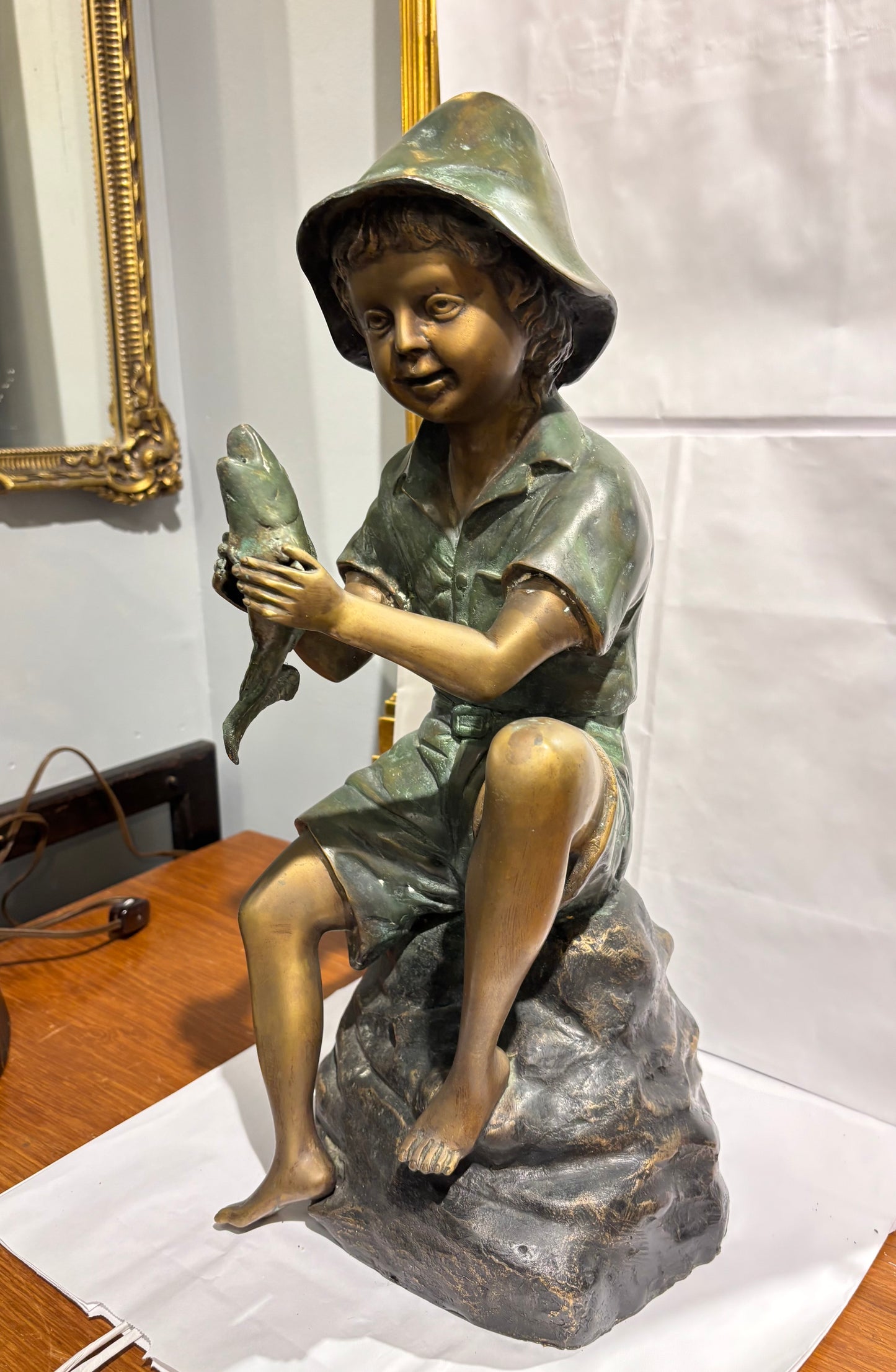 Boy Holding a Fish Bronze statue